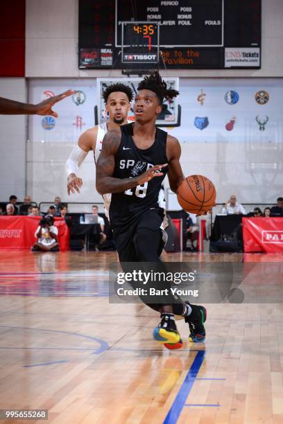 Lonnie Walker IV of the San Antonio Spurs handles the ball against the Portland Trail Blazers during the 2018 Las Vegas Summer League on July 10,...