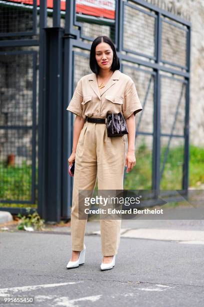 Tiffany Hsu wears a beige shirt, beige pants, white shoes , outside Vetements, during Paris Fashion Week Haute Couture Fall Winter 2018/2019, on July...