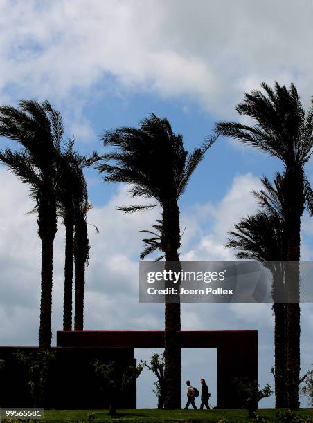 Two journalists on their way to the press conference are pictured at Verdura Golf and Spa Resort where the Geman National Football Team stays for...