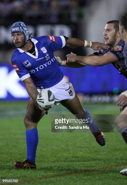 Johnathan Thurston of the Cowboys looks to pass the ball during the round 10 NRL match between the Warriors and the North Queensland Cowboys at Mt...