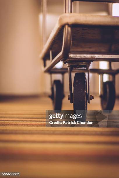 luggage carrier down low - patrick hall stock pictures, royalty-free photos & images