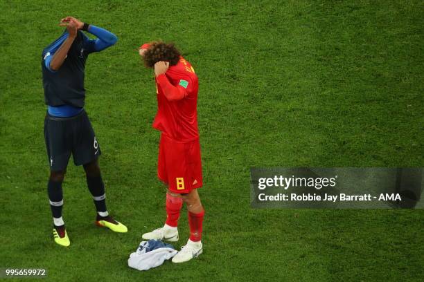 Manchester United teammates Paul Pogba of France and Marouane Fellaini of Belgium at full time during the 2018 FIFA World Cup Russia Semi Final match...