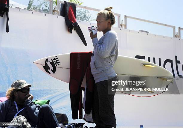 Surfer recovers after competing in the Swatch Girls pro competition, a stage of the surf world qualifying series on May 14, 2010 in Soorts-Hossegor,...