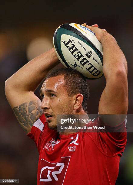 Quade Cooper of the Reds waits for a referees decision during the round 14 Super 14 match between the Reds and the Highlanders at Suncorp Stadium on...