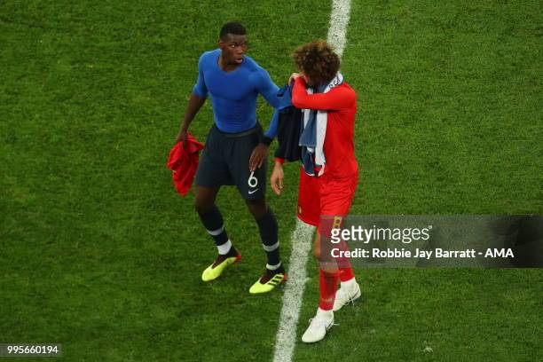 Manchester United teammates Paul Pogba of France and Marouane Fellaini of Belgium at full time during the 2018 FIFA World Cup Russia Semi Final match...