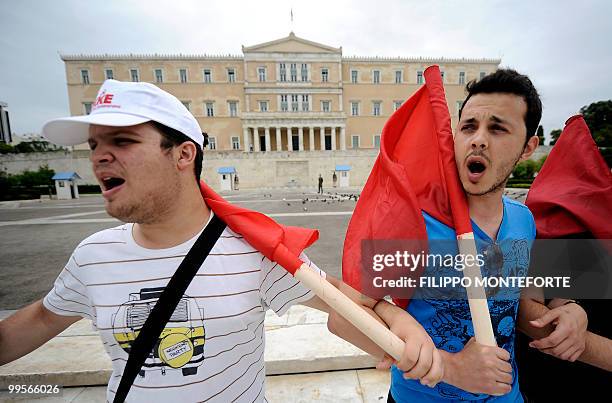 Comunist demonstrators of the KKE stand in front of the Greek parliament on May 15, 2010 to protest against the Government. The austerity package...