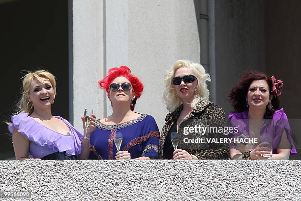 Actresses Julie Atlas Muz, Dirty Martini, Mimi Le Meaux and Kitten on the Keys playing in the film "On Tour" drink champagne on a terasse at the 63rd...