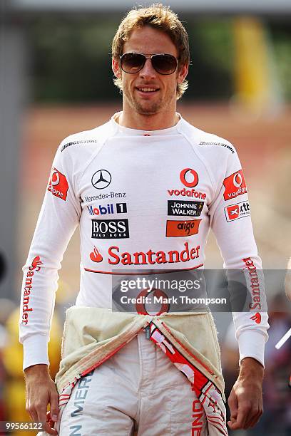 Jenson Button of Great Britain and McLaren Mercedes walks in the paddock prior to qualifying for the Monaco Formula One Grand Prix at the Monte Carlo...