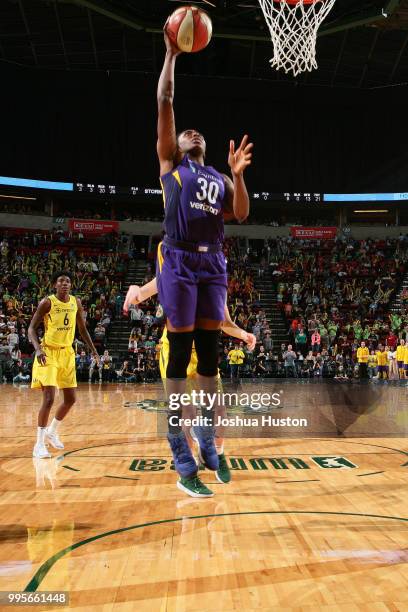 Nneka Ogwumike of the Los Angeles Sparks goes to the basket against the Seattle Storm on July 10, 2018 at Key Arena in Seattle, Washington. NOTE TO...
