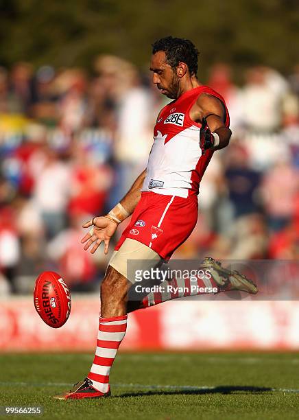 Adam Goodes of the Swans kicks during the round eight AFL match between the Western Bulldogs and the Sydney Swans at Manuka Oval on May 15, 2010 in...