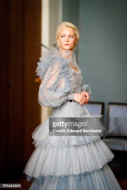 Model wears a blue mesh lace ruffled dress during the Ulyana Sergeenko Haute Couture Fall Winter 2018/2019 show as part of Paris Fashion Week on July...