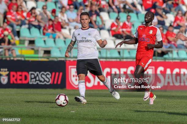 Benfica defender Alex Grimaldo from Spain faster that FK Napredak forward Ibrahima NDiaye from Senegal wins the ball during the Benfica v FK Napredak...