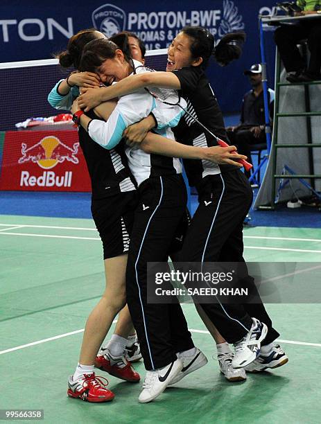 South Korean team members celebrate their victory over China in the Uber Cup badminton championships in Kuala Lumpur on May 15, 2010. South Korea...