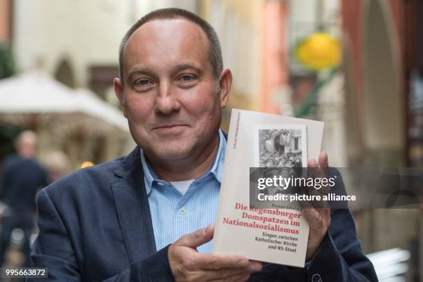 Historian Roman Smolorz presents the book titled 'Regensburger Domspatzen im Nationalsozialismus - Singen zwischen Katholischer Kirche und NS-Staat'...