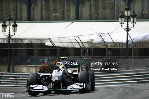 Nico Rosberg of Germany and Mercedes GP drives through Casino Square in the final practice session prior to qualifying for the Monaco Formula One...