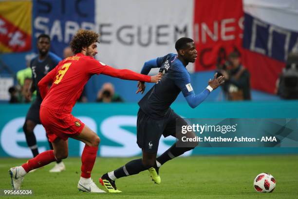 Marouane Fellaini of Belgium and Paul Pogba of France during the 2018 FIFA World Cup Russia Semi Final match between Belgium and France at Saint...