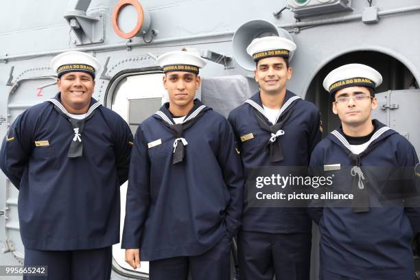 Sailors stand on deck onboard the Brazilian training vessel 'Navio Escola Brasil' at a pier in Hamburg harbour, Germany, 28 September 2017. The...