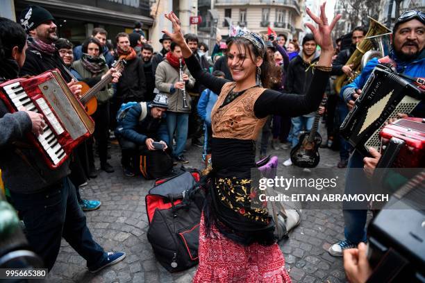 Street artists demonstrate in front of the Buenos Aires City Legislature in the Argentine capital on July 10 rejecting a bill that regularizes their...