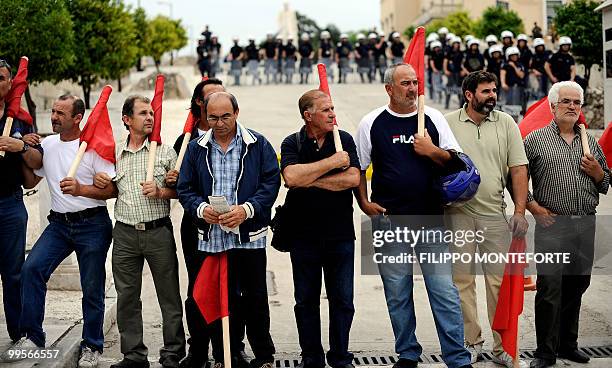 Communist demonstrators of the KKE stand in front of the Greek parliament during a rally in Athens on May 15, 2010. The austerity package adopted by...