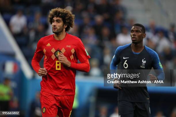 Marouane Fellaini of Belgium and Paul Pogba of France during the 2018 FIFA World Cup Russia Semi Final match between Belgium and France at Saint...