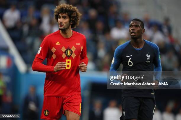 Marouane Fellaini of Belgium and Paul Pogba of France during the 2018 FIFA World Cup Russia Semi Final match between Belgium and France at Saint...