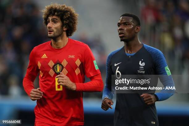 Marouane Fellaini of Belgium and Paul Pogba of France during the 2018 FIFA World Cup Russia Semi Final match between Belgium and France at Saint...