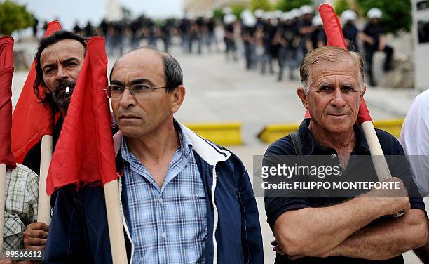 Communist demonstrators of the KKE stand in front of the Greek parliament durign a rally in Athens on May 15, 2010. The austerity package adopted by...