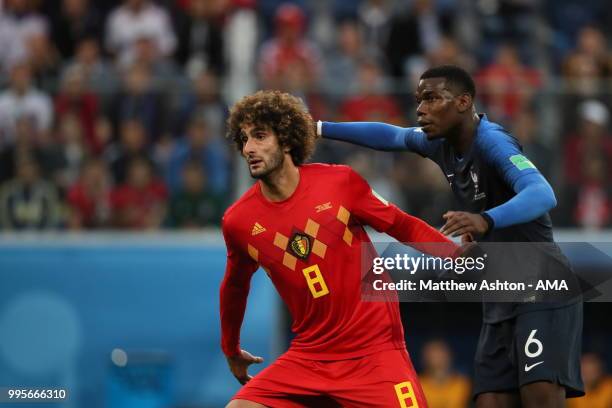 Marouane Fellaini of Belgium and Paul Pogba of France during the 2018 FIFA World Cup Russia Semi Final match between Belgium and France at Saint...