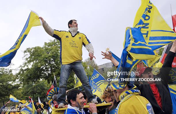 Clermont's supporters wave flags on May 15, 2010 in the streets of Saint-Etienne before the French Top 14 semi final rugby match Clermont-Ferrand...