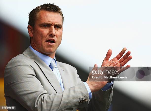 Lee Clark, manager of Huddersfield Town appluds his players during the Coca-Cola League One Playoff Semi Final 1st Leg match between Huddersfield...