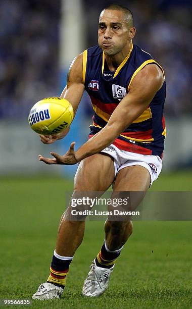 Andrew Mcleod of the Crows hanballs the ball during the round eight AFL match between the North Melbourne Kangaroos and the Adelaide Crows at Etihad...