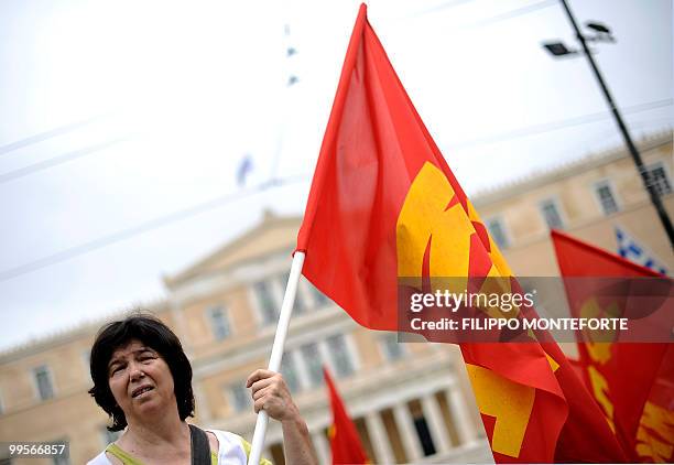 Communist demonstrators of the KKE march in front of the parliament in central Athens on May 15, 2010 to protest against the Government. The...