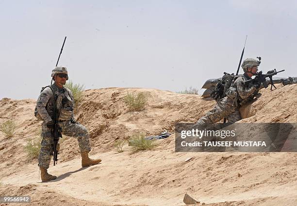 Soldiers from Bravo Troop 1-71 CAV patrol near Belanday village, Dand district in Kandahar on May 15, 2010. NATO and the United States are deploying...