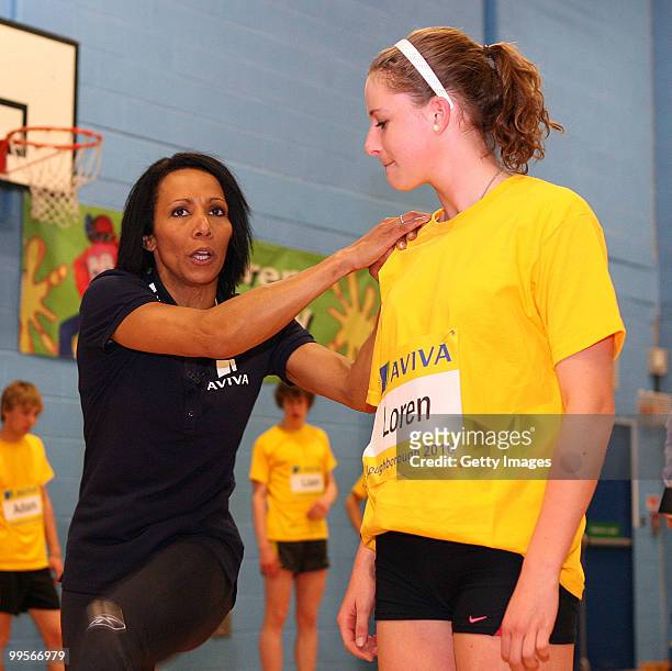 Dame Kelly Holmes with Lauren Bleaken during the Aviva sponsored mentoring day for young athletes at Loughborough College on May 15, 2010 in...