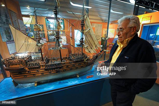 Treasure hunter Ruben Collado speaks at the "Shipwrecked and Treasures" museum, in front of a model of the British 64-cannon ship Lord Clive, sunk in...