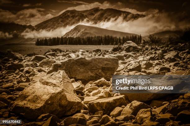 land alongside lake tekapo - tekapo stock pictures, royalty-free photos & images