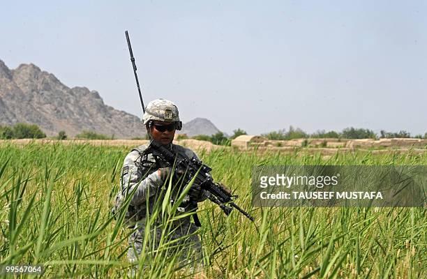 Soldier from Bravo Troop 1-71 CAV patrols near Belanday village, Dand district in Kandahar on May 15, 2010. NATO and the United States are deploying...