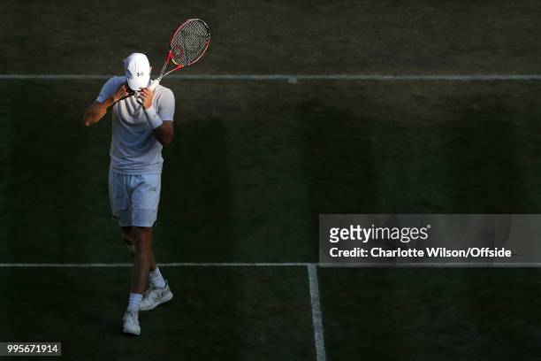 Mens Doubles - Raven Klaasen & Michael Venus v Jamie Murray & Bruno Soares - A dejected Jamie Murray adjusts his hat at All England Lawn Tennis and...