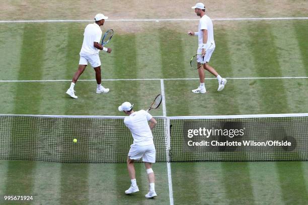 Mens Doubles - Raven Klaasen & Michael Venus v Jamie Murray & Bruno Soares - Raven Klaasen and Michael Venus celebrate winning a point as a dejected...