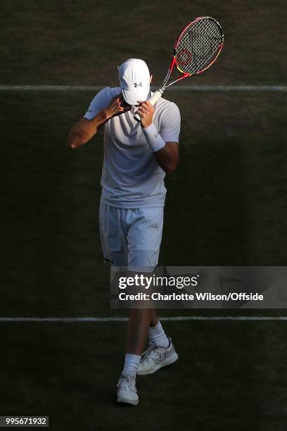 Mens Doubles - Raven Klaasen & Michael Venus v Jamie Murray & Bruno Soares - A dejected Jamie Murray adjusts his hat at All England Lawn Tennis and...