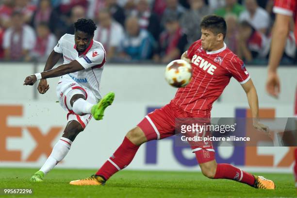 Cologne's Jorge Mere cannot stop Belgrade's Richmond Boakye's 0-1 score during the Europa League match between 1.FC Cologne vs. Red Star Belgrade at...