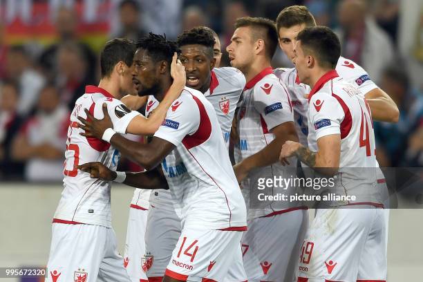 Belgrade's players celebrate Richmond Boakye's 0-1 score during the Europa League match between 1.FC Cologne vs. Red Star Belgrade at the...