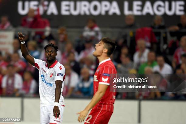 Dpatop - Belgrade's Richmond Boakye cheers over his 0-1 score during the Europa League match between 1.FC Cologne vs. Red Star Belgrade at the...