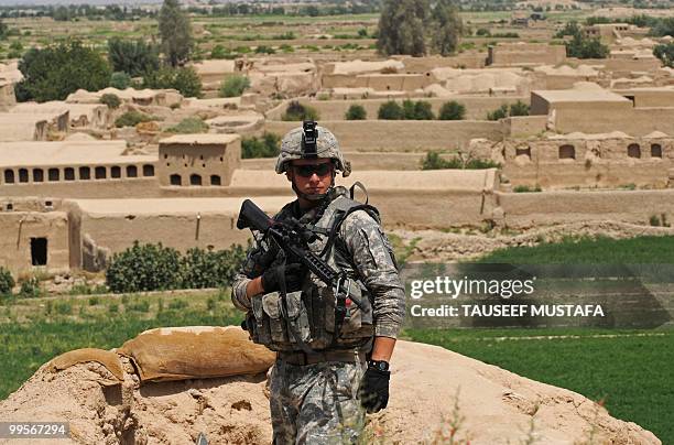 Soldier from Bravo Troop 1-71 CAV patrols a police post near Belanday village, Dand district in Kandahar on May 15, 2010. NATO and the United States...