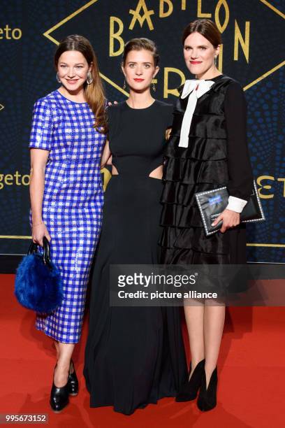 Actresses Hannah Herzsprung , Liv Lisa Fries and Fritzi Haberlandt arrive, walking over the red carpet for the premiere of the TV series "Babylon...