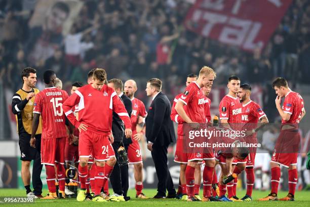 Cologne's team stands defeated after the Europa League match between 1.FC Cologne vs. Red Star Belgrade at the RheinEnergieStadium in Cologne,...