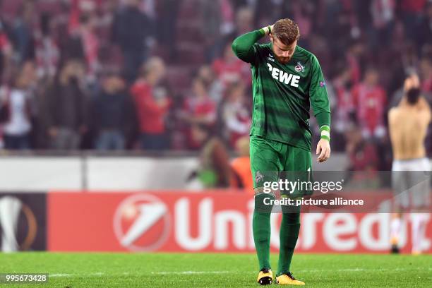 Cologne's goalkeeper Timo Horn stands defeated after the Europa League match between 1.FC Cologne vs. Red Star Belgrade at the RheinEnergieStadium in...