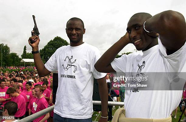 Patrick Vieira and Sol Campbell of Arsenal prepare to fire the gun at the start of the Nike 10k run at Kew Gardens, London. Sol Campbell said of the...