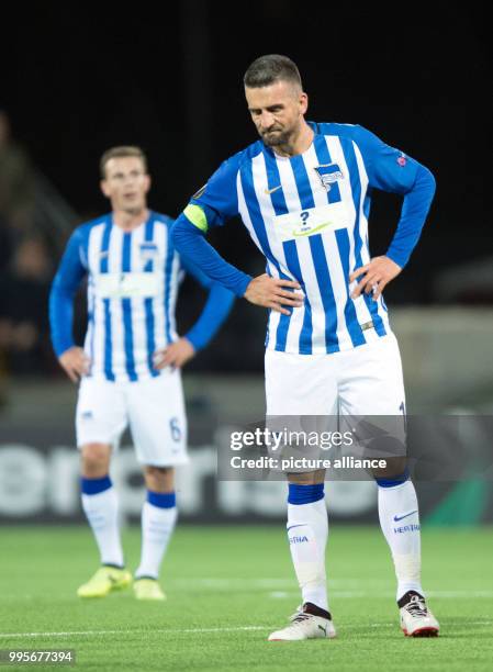 Hertha's Vladimir Darida and Vedad Ibisevic stand dejected after the Europa League match between Ostersunds FK and Hertha BSC at the Jaemtkraft Arena...