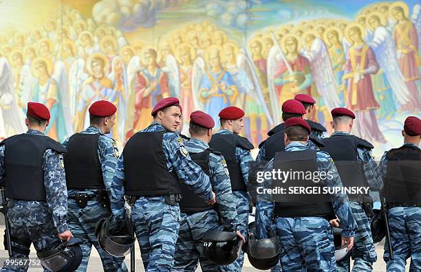 Riot policemen walk in front of Mykhaylo Gold Dome cathedral's frescos as they guard activists of Ukrainian ultra-nationalist party Svoboda in...